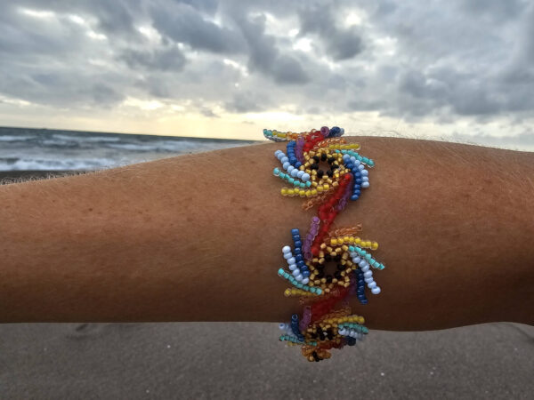 Rainbow Vortex on the hand on the beach