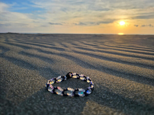 Beautiful Mystical Gaze bracelet at sunset at the beach