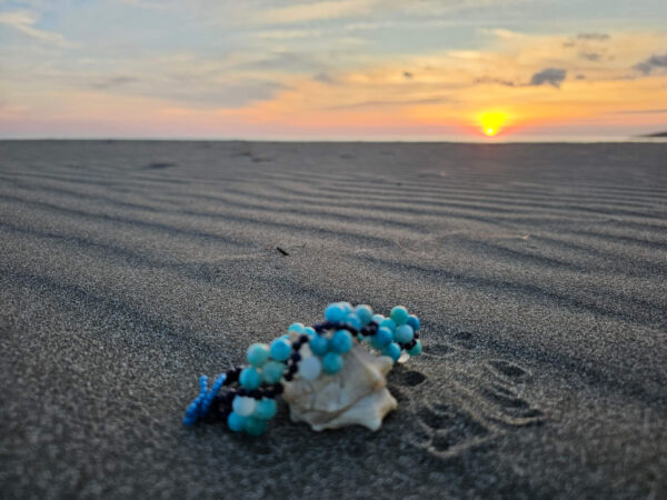 Emotionally Healing Flow Gemstone Bracelet At Sunset at the Beach