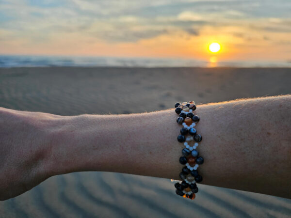 Healing Shield and Grounding on hand at the beach