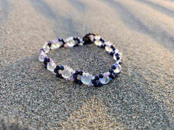 Mystical Gaze bracelet at the beach on a circle