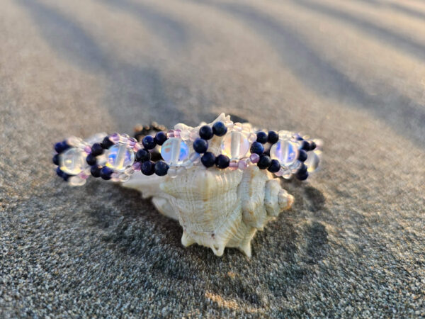 Mystical Gaze bracelet on a shell at the beach