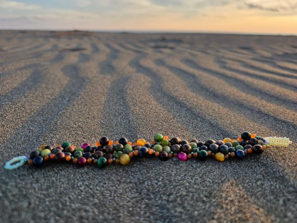 Grounded Protection gemstone bracelet at the beach